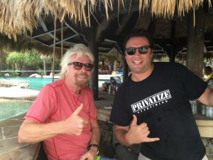 The BitClub Network's Jobadiah Weeks pictured with Sir Richard Branson in 2016